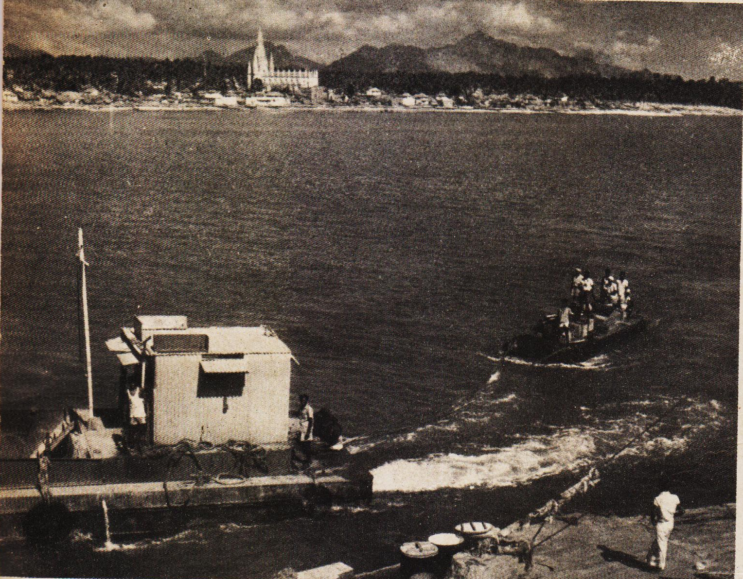 A towed pontoon nearing the landing platform put up at the foot of the Rock.