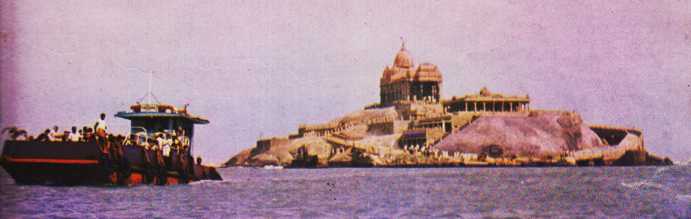 A front diagoanal view of the Memorial from the norht with the committee's motor launch 'Vikrama' with passengers on board approching the Rock.