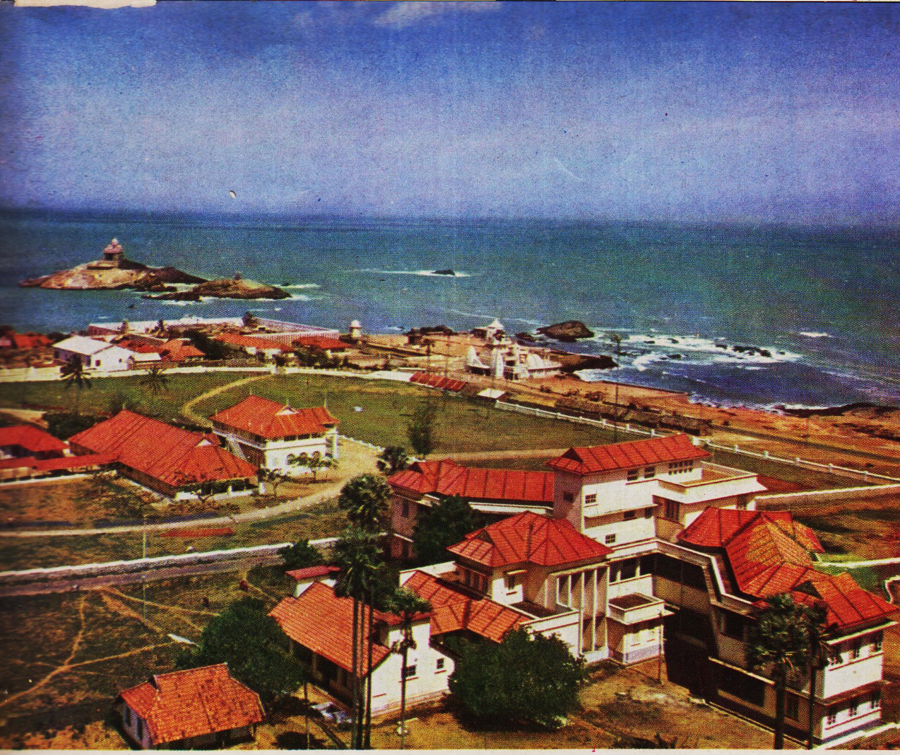 A bird's eye view of a part of the Kanyakumari village situated at the sourthen extremity of the Mainland of Bharat. To the south-east of the tapering end where the Kanyakumari Temple stands within its walled encloure, is seen the Vivekananda Rock and the Memorial adorining its crest.