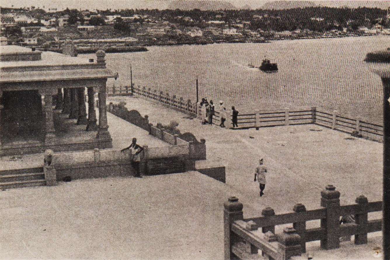 A porting of the Shripada Mandapam, the Kanyakumari shore and the interventing sea as viewed from the steps of the V. Mandapam.