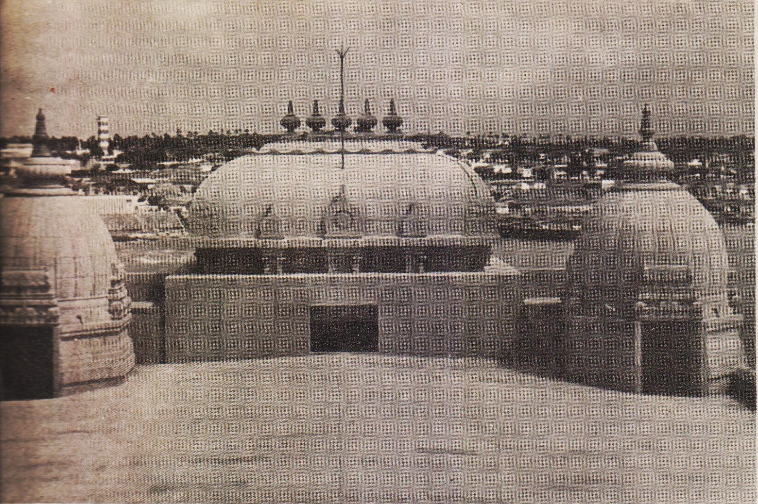 A rear view of the rectangular Shikharam over the Mukha Mandapam (Porch) and of the two minor Shikharams over the two side rooms at the Main Entrance of the Sabha Mandapam.