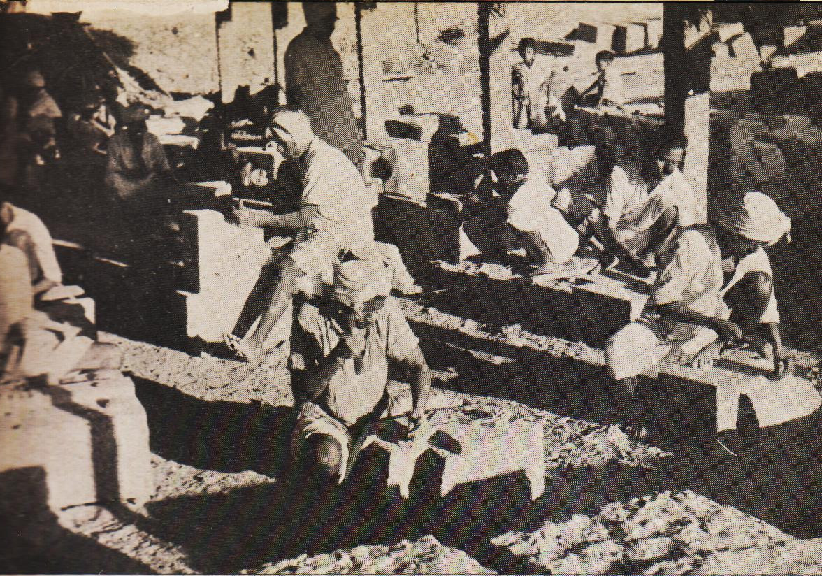 A close view of two of the several work - sheds put up for stone-dressing work. 